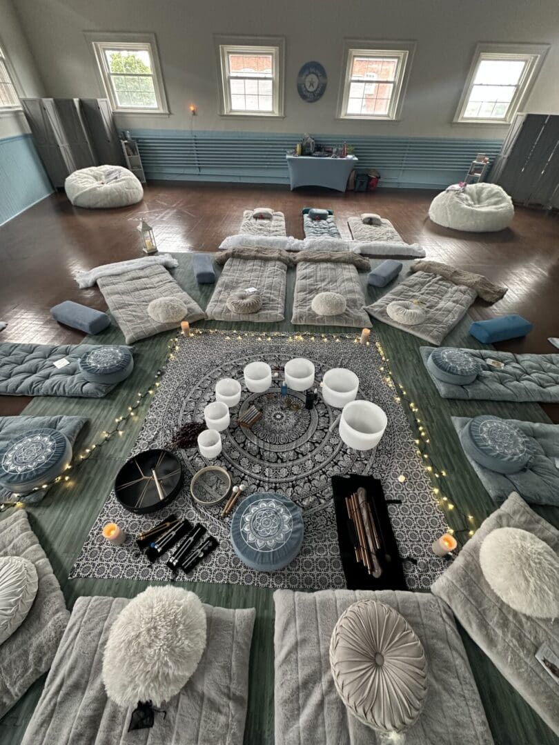 A room with many pillows and rugs on the floor A room with many pillows and rugs on the floor